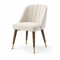 Silla tapizada de tela beige con patas de madera y detalles dorados 81cm
